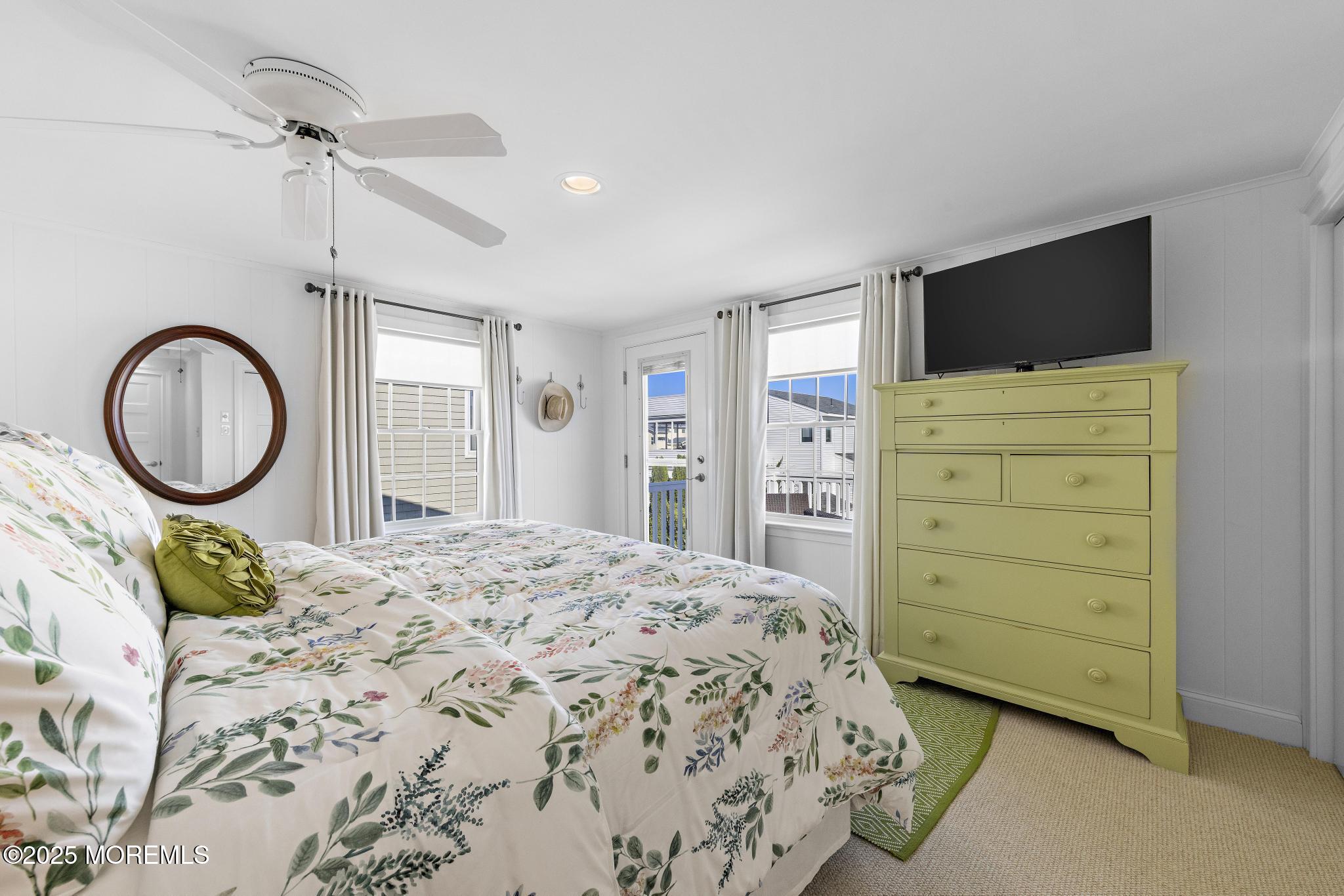 9 Inlet Road Beach Haven, NJ 08008 - Photo 18 of 51 a bedroom with a bed and a television