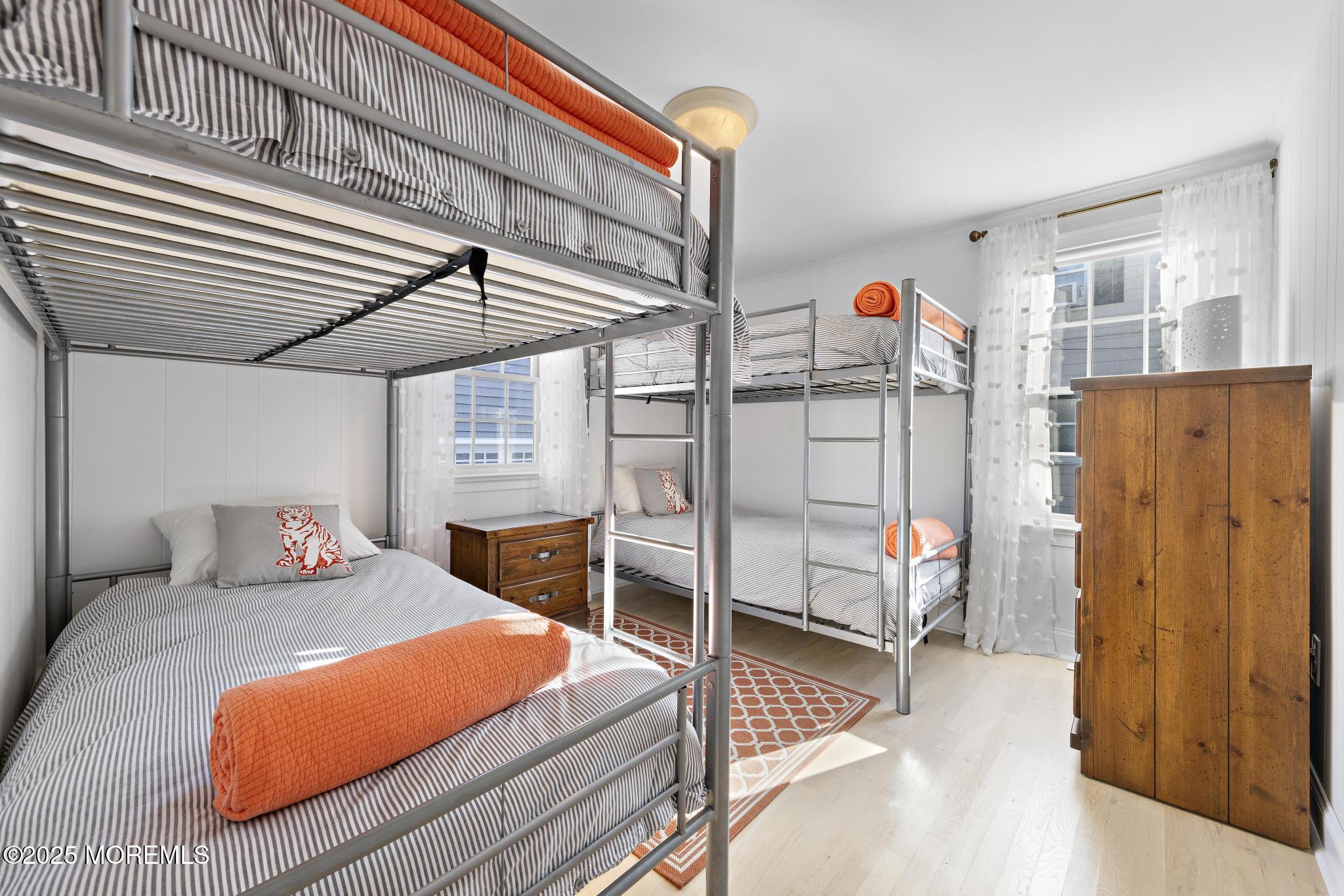 9 Inlet Road Beach Haven, NJ 08008 - Photo 22 of 51 a bedroom with a bed and a window