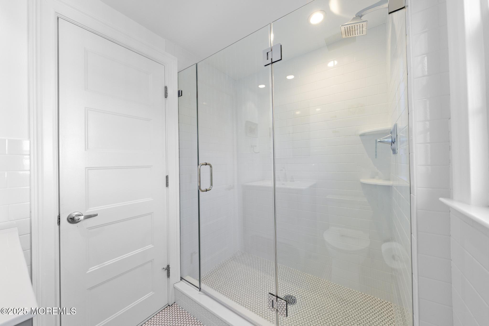 9 Inlet Road Beach Haven, NJ 08008 - Photo 24 of 51 a bathroom with a shower and a glass door