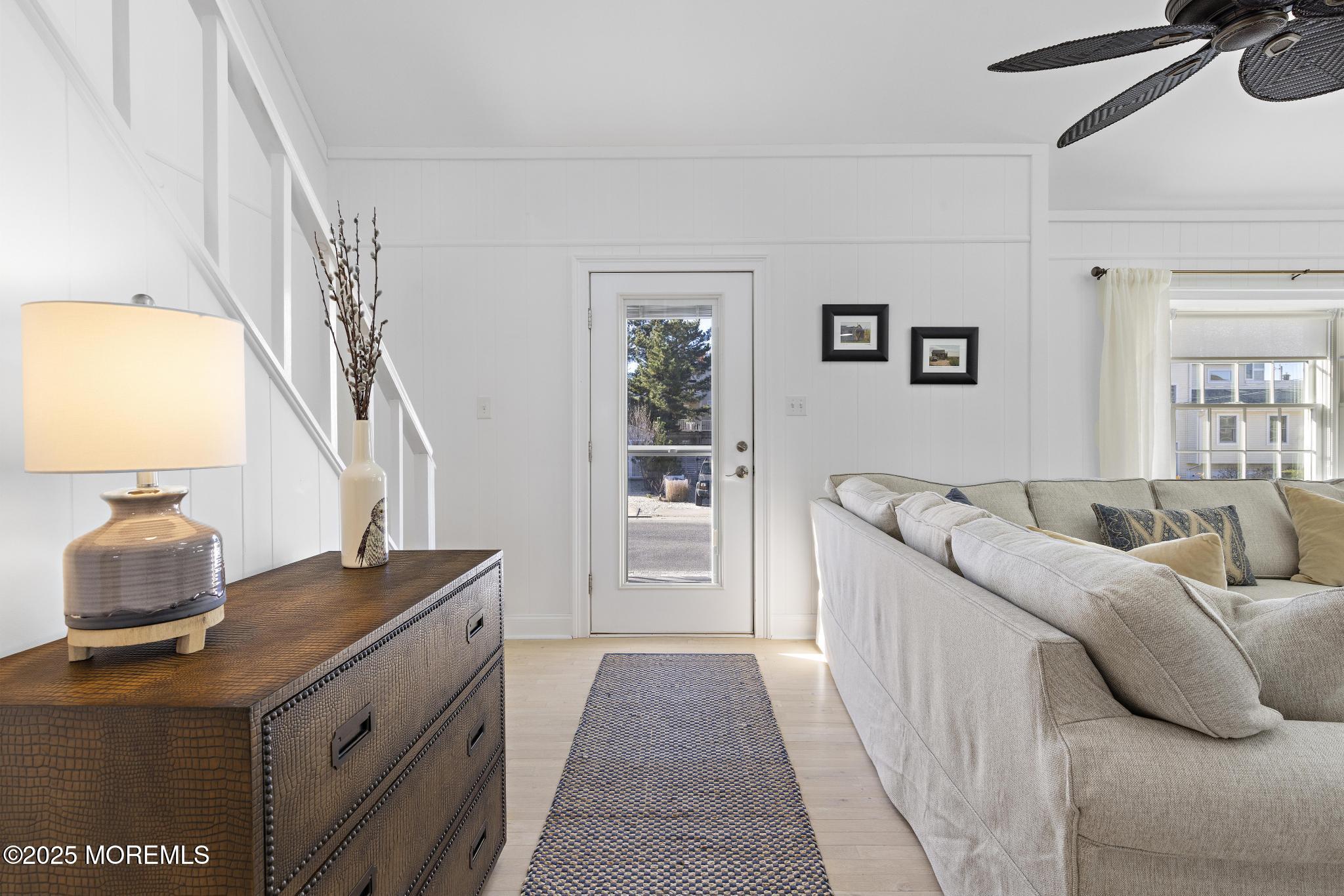 9 Inlet Road Beach Haven, NJ 08008 - Photo 28 of 51 a living room with furniture and a table
