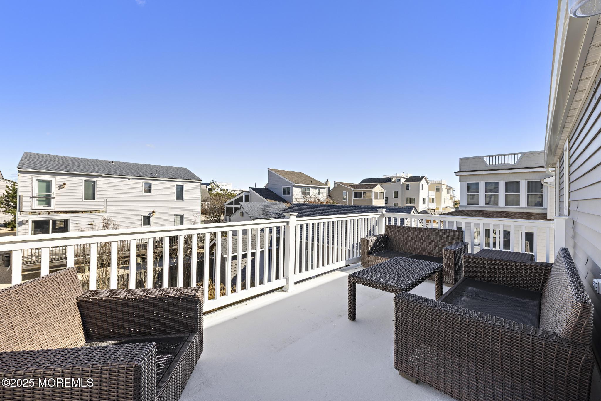 9 Inlet Road Beach Haven, NJ 08008 - Photo 29 of 51 a view of a balcony with furniture