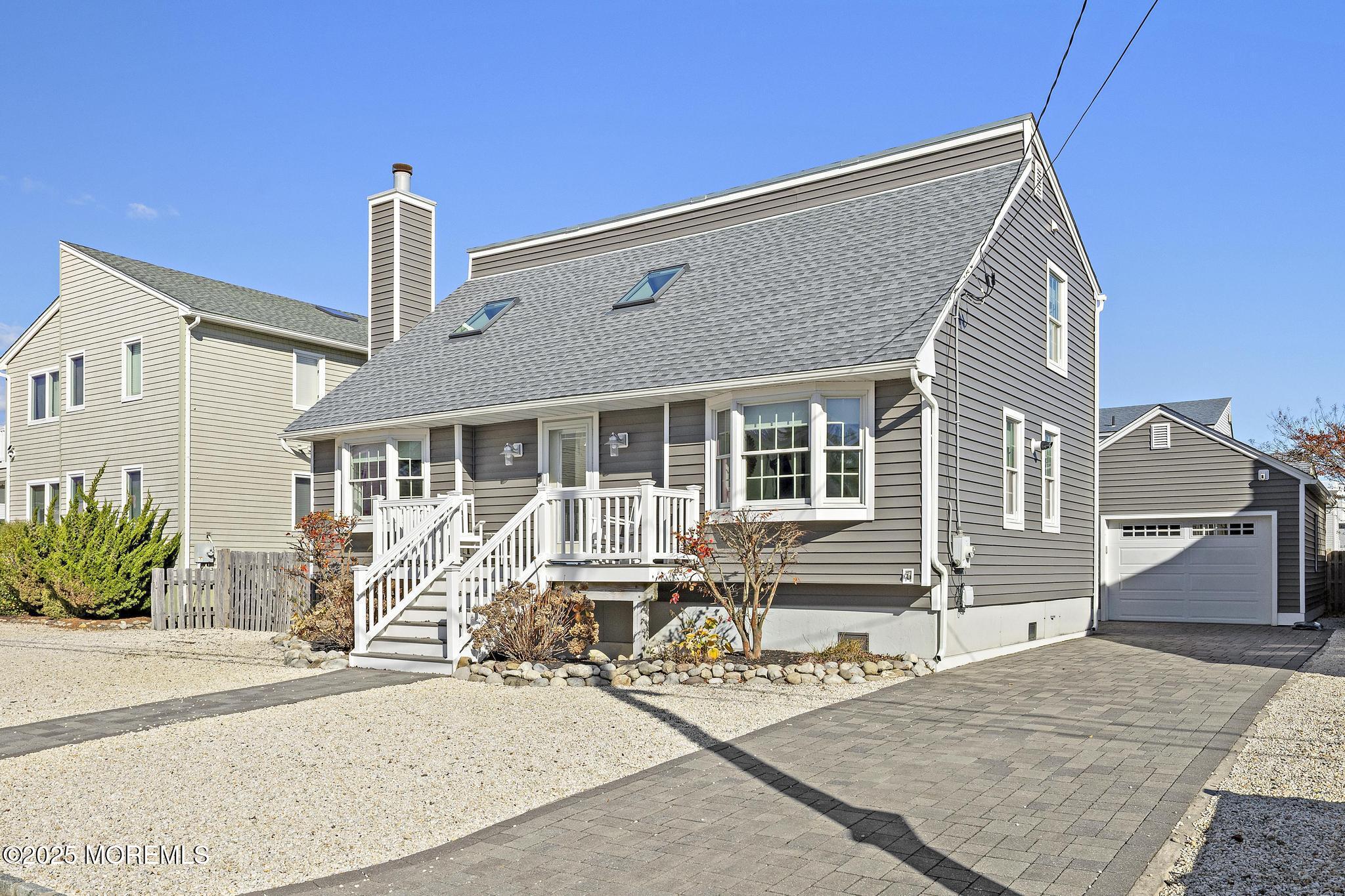 9 Inlet Road Beach Haven, NJ 08008 - Photo 37 of 51 a front view of a house with garden