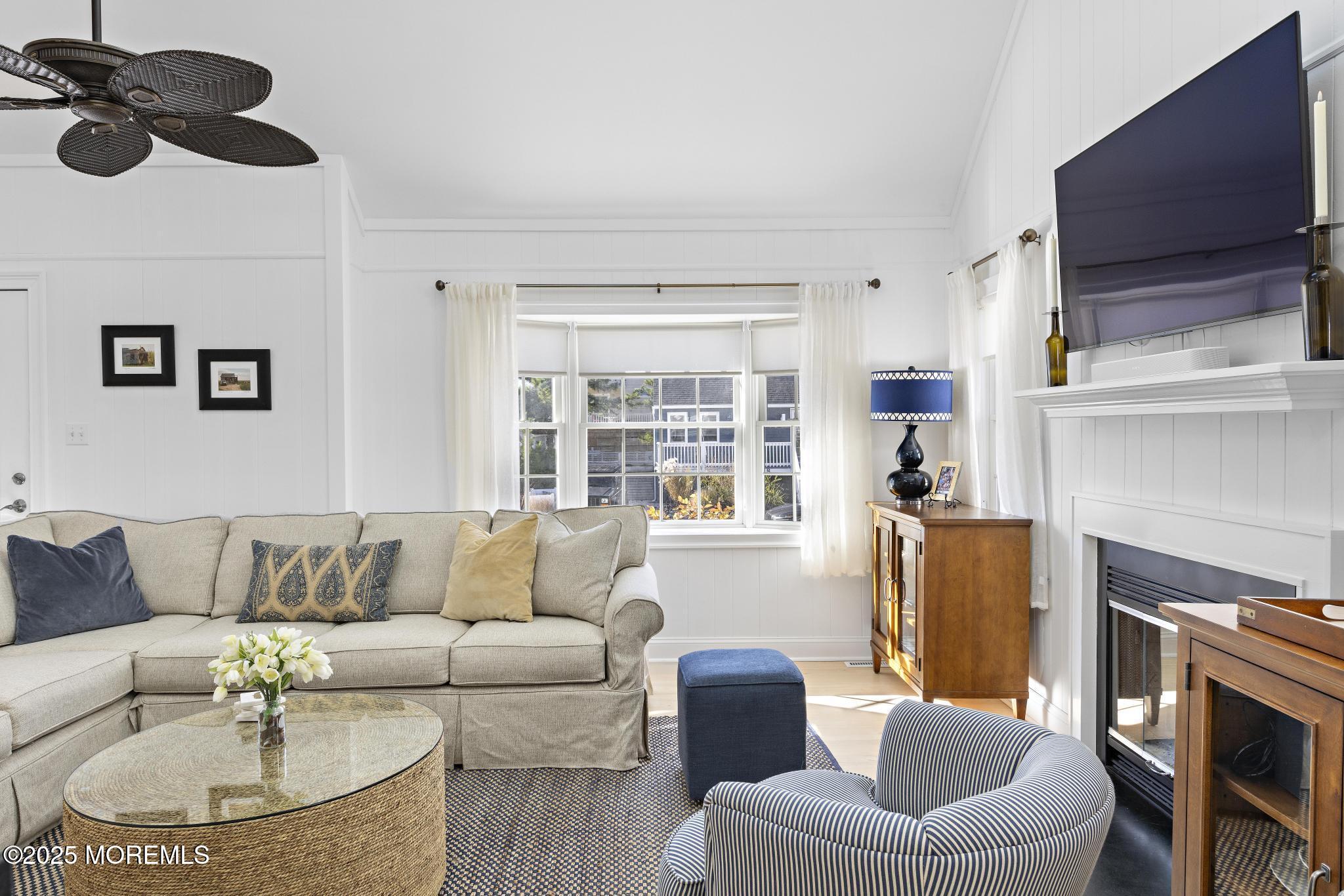 9 Inlet Road Beach Haven, NJ 08008 - Photo 6 of 51 a living room with furniture and a fireplace