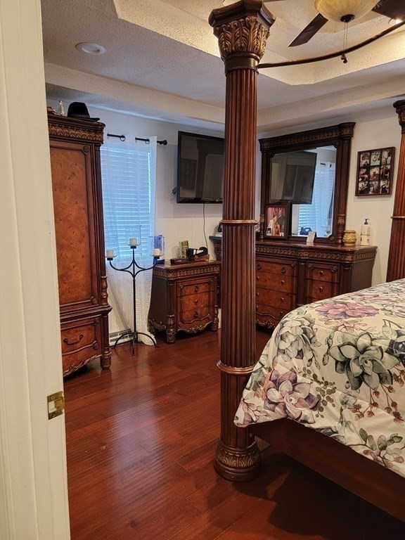 192 Starling Road Springfield, MA 01119 - Photo 19 of 26 a bedroom with furniture and a flat screen tv