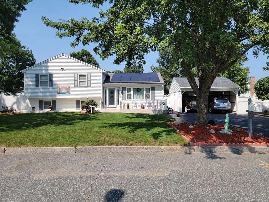 192 Starling Road Springfield, MA 01119 - Photo 2 of 26 a front view of a house with a yard and garage