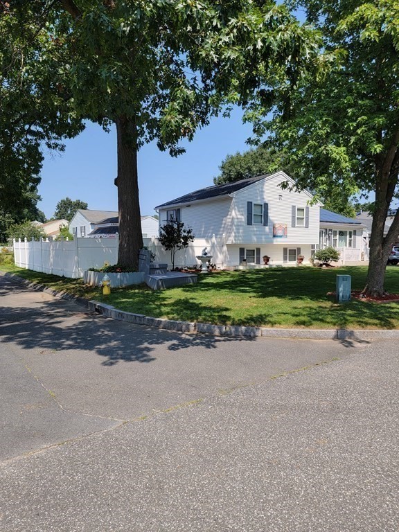 192 Starling Road Springfield, MA 01119 - Photo 5 of 26 a front view of a house with a yard and garage