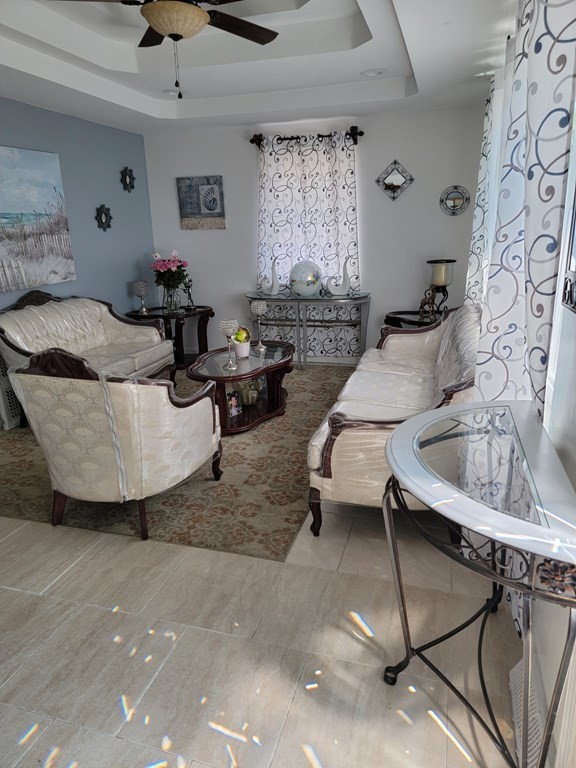 192 Starling Road Springfield, MA 01119 - Photo 7 of 26 a living room with furniture and window