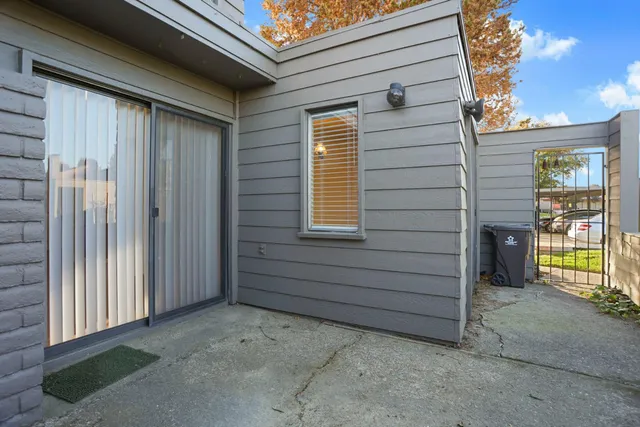 a view of front door and a window
