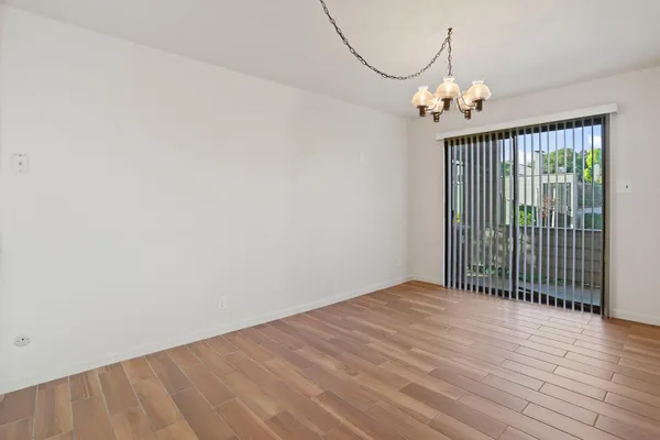 en empty room with wooden floor