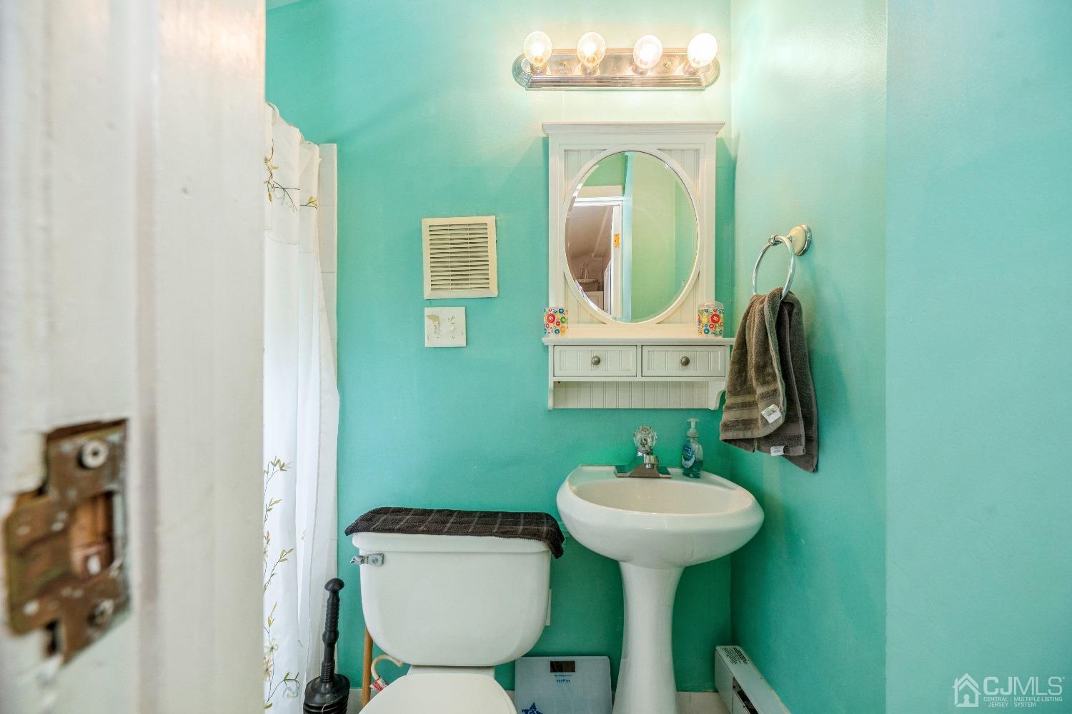 1100 Junction Road Browns Mills, NJ 08015 - Photo 17 of 27 a bathroom with a toilet sink and mirror