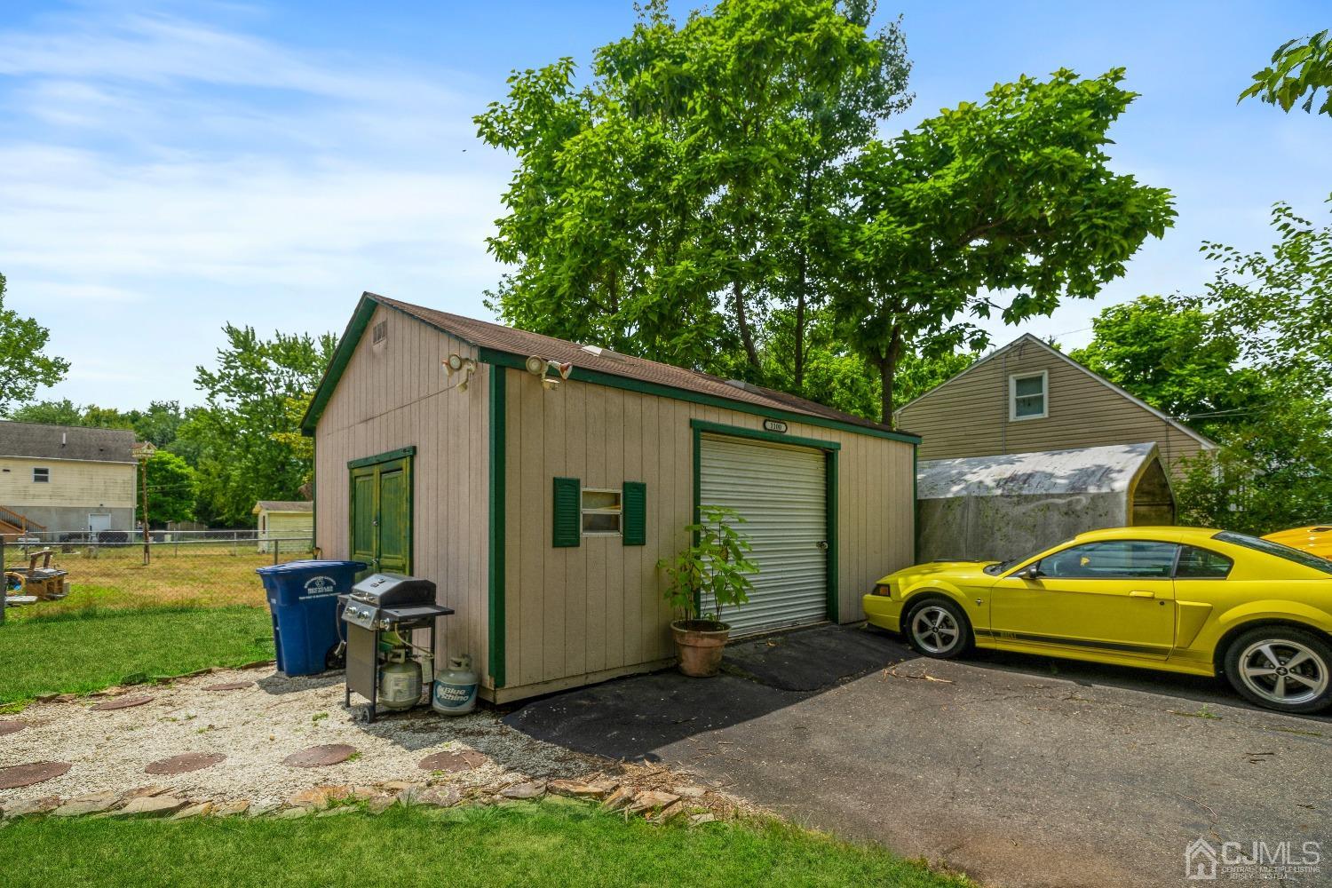 1100 Junction Road Browns Mills, NJ 08015 - Photo 26 of 27 a view of a backyard with a car parked in it