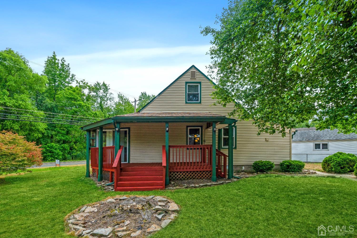 1100 Junction Road Browns Mills, NJ 08015 - Photo 3 of 27 a front view of a house with a garden