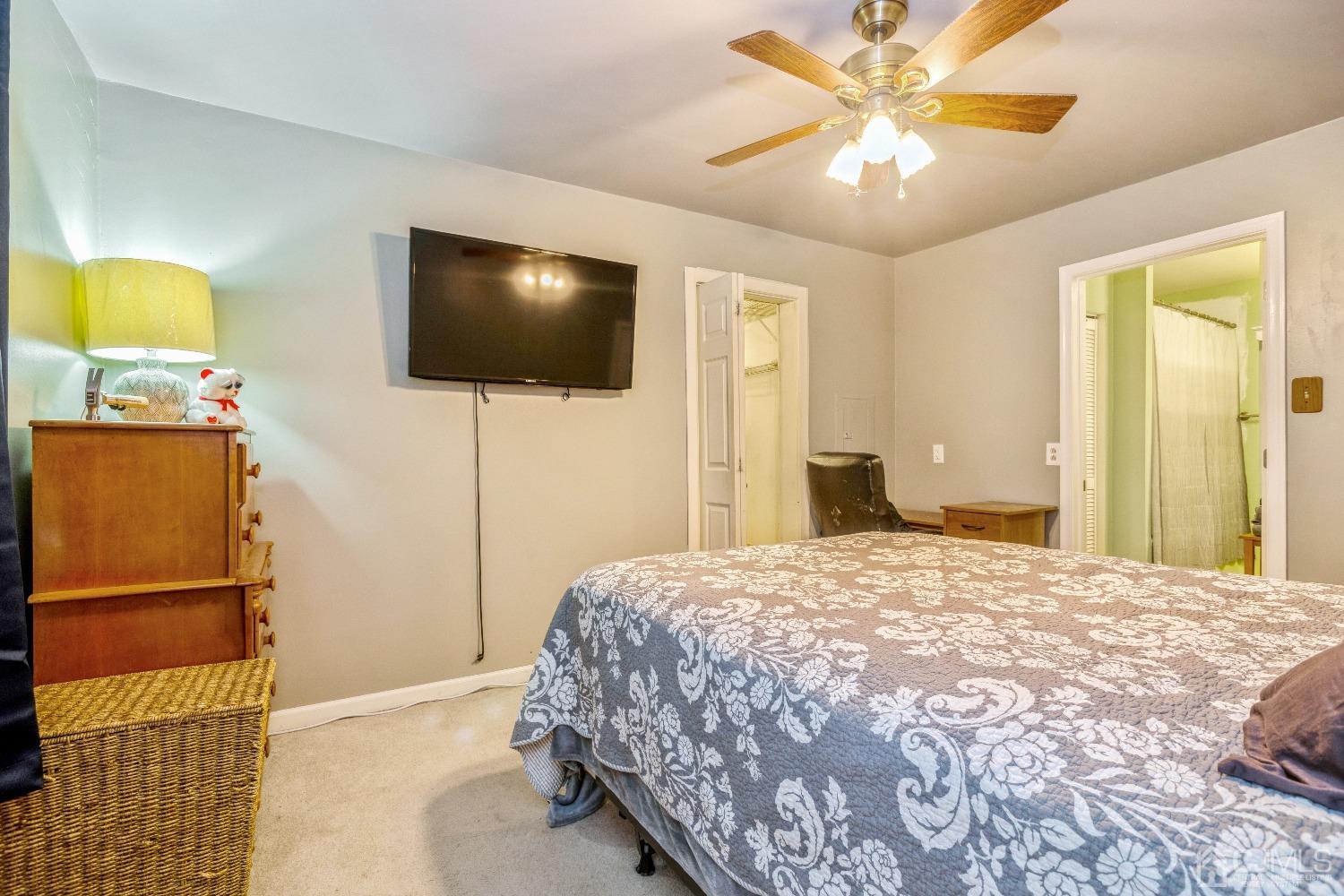 1100 Junction Road Browns Mills, NJ 08015 - Photo 9 of 27 a bedroom with a bed and a flat screen tv