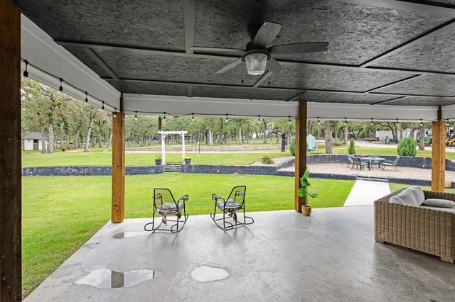 a view of swimming pool with a patio