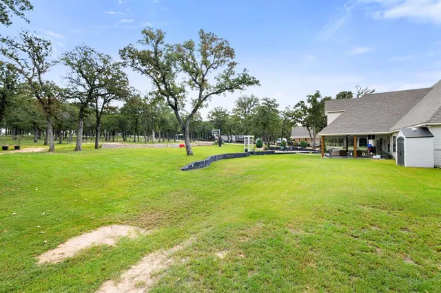 a view of a park with swings and slides