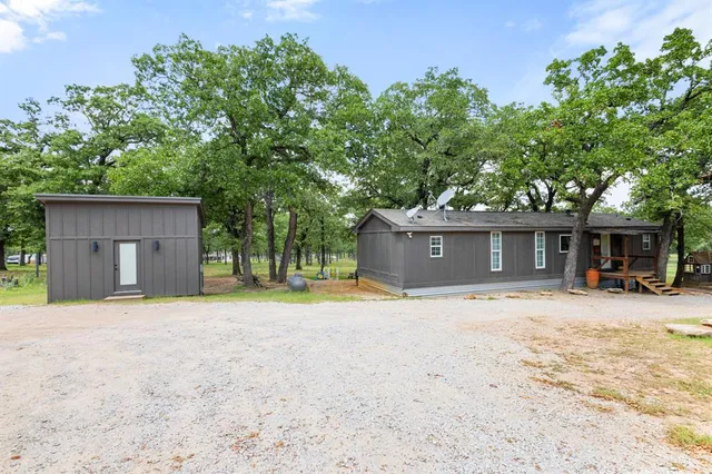 a house with trees in the background