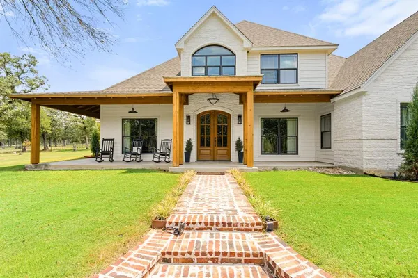 a view of a house with swimming pool