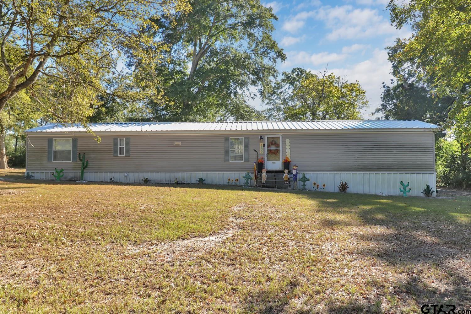 a house view with a backyard space