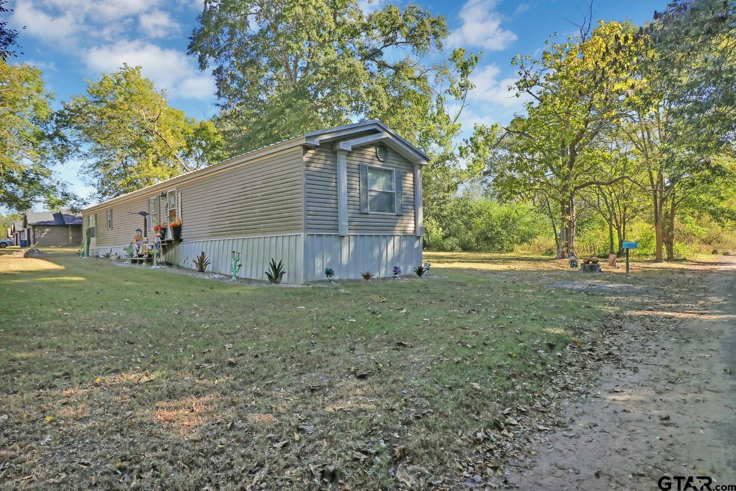 602 North Commerce Street Overton, TX 75684 - Photo 14 of 17 a house view with backyard space