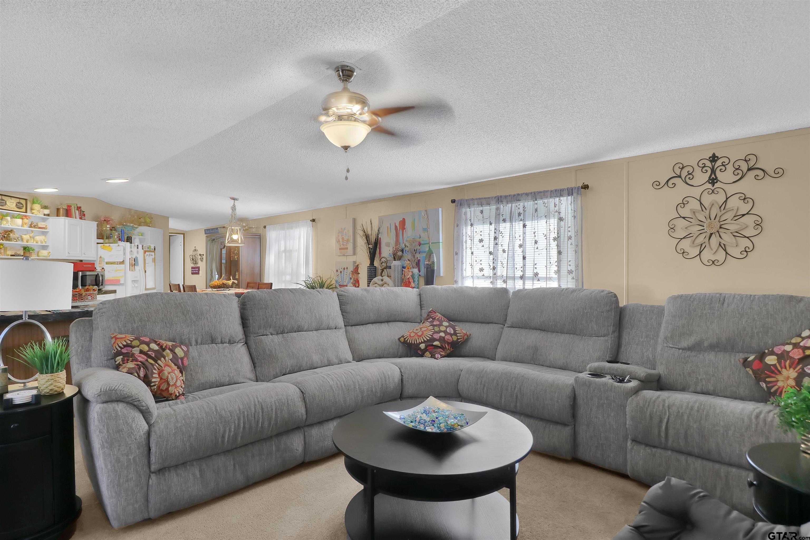 602 North Commerce Street Overton, TX 75684 - Photo 3 of 17 a living room with furniture and a large window