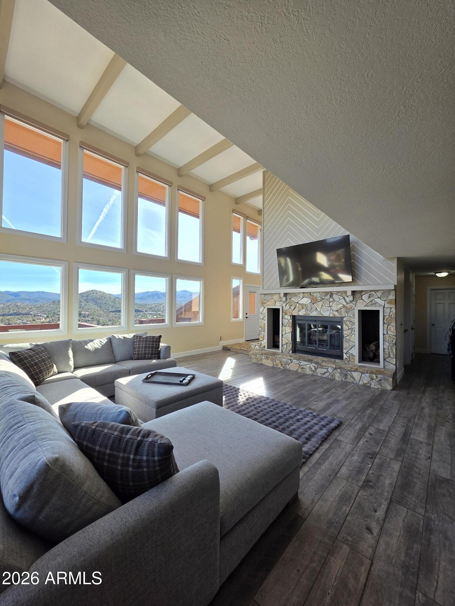 4880 Comanche Trail Prescott, AZ 86301 - Photo 13 of 44 a living room with furniture and a fireplace