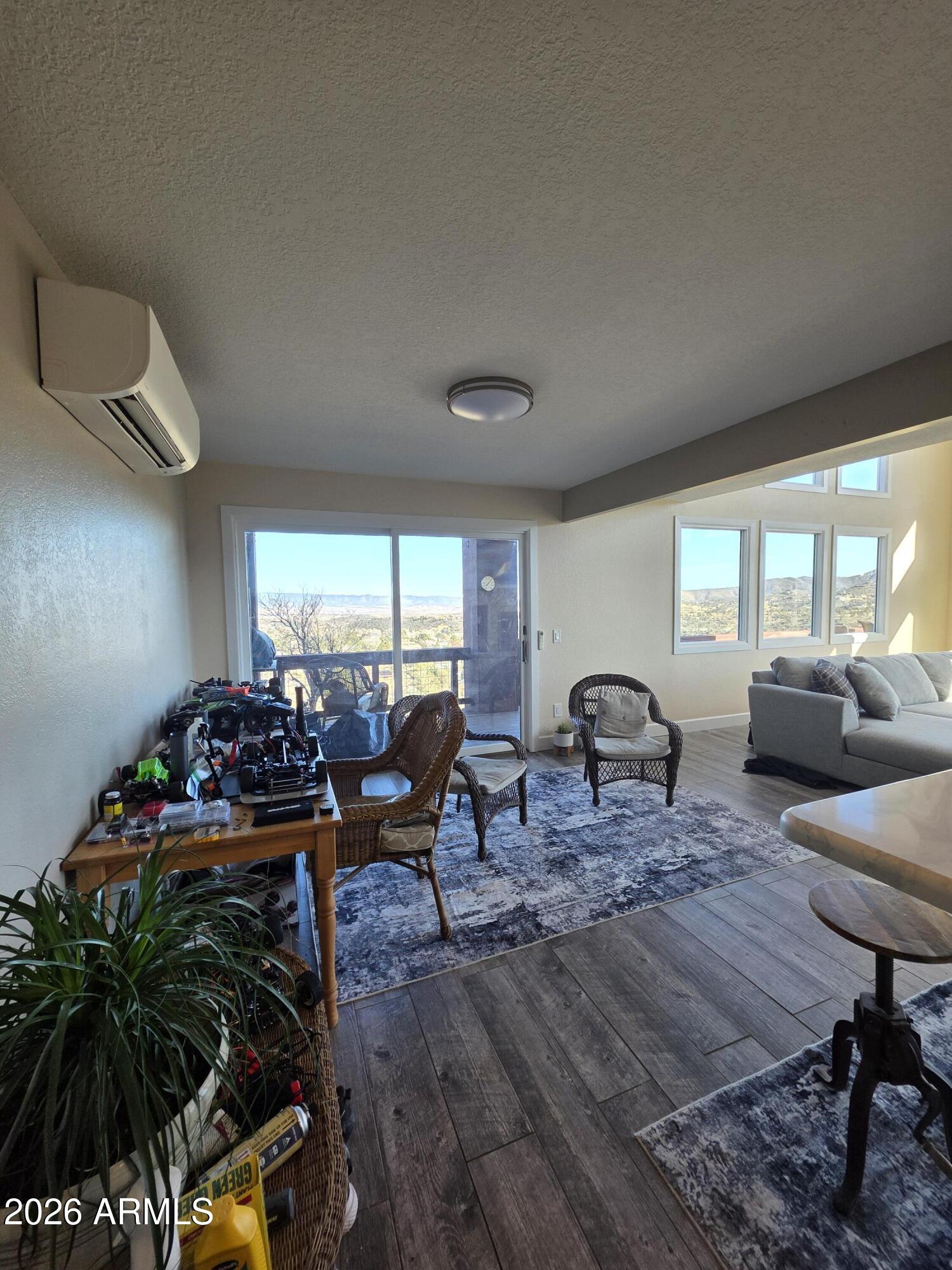 4880 Comanche Trail Prescott, AZ 86301 - Photo 19 of 44 a living room with furniture and a potted plant