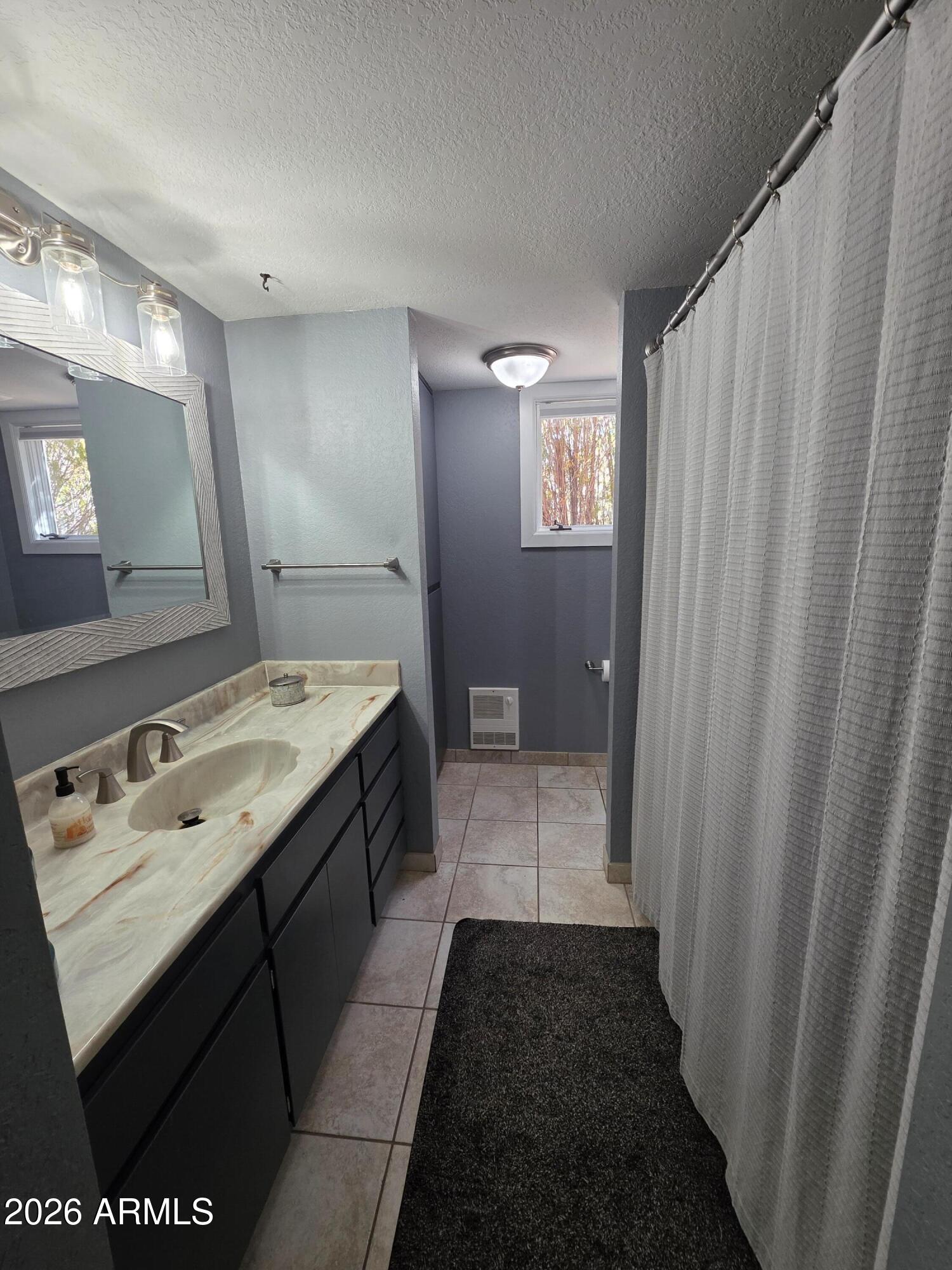 4880 Comanche Trail Prescott, AZ 86301 - Photo 22 of 44 a bathroom with a sink and a mirror