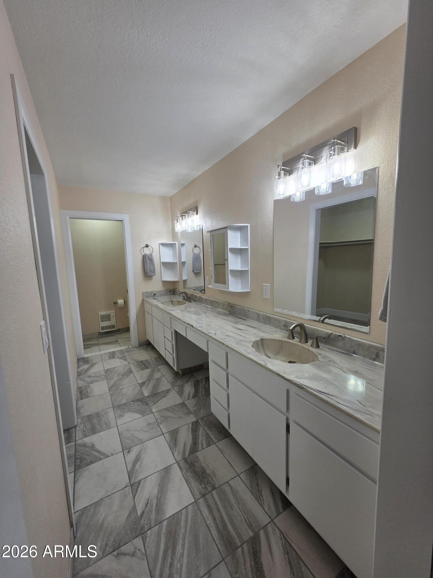 4880 Comanche Trail Prescott, AZ 86301 - Photo 30 of 44 a spacious bathroom with a double vanity sink and a mirror