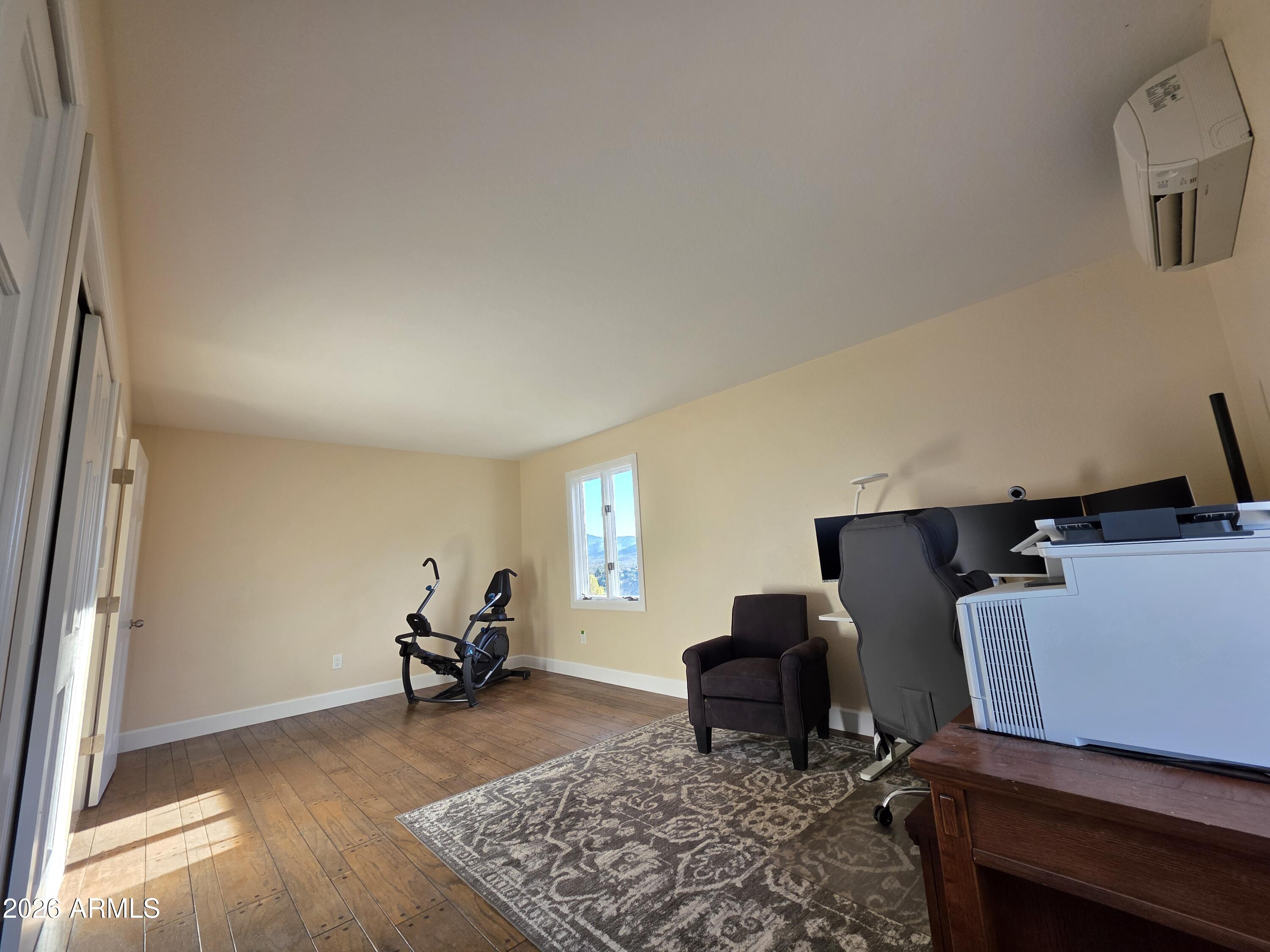 4880 Comanche Trail Prescott, AZ 86301 - Photo 34 of 44 a living room with furniture rug and a window