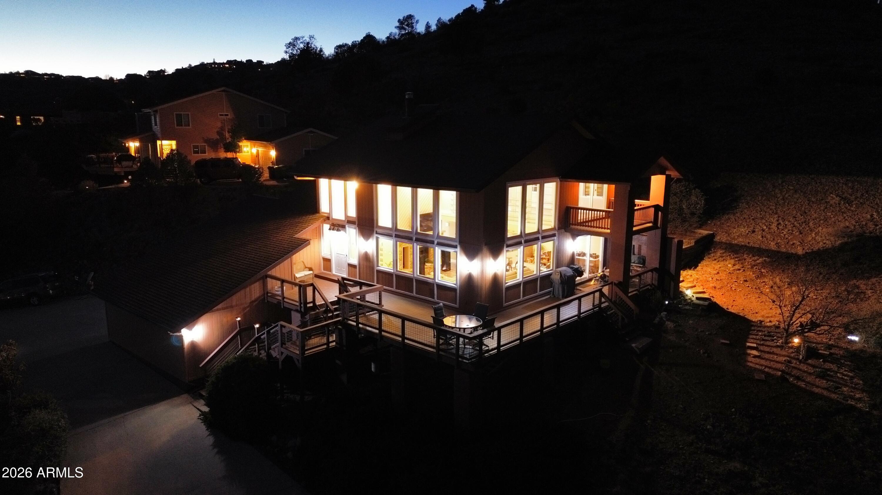 4880 Comanche Trail Prescott, AZ 86301 - Photo 38 of 44 a roof deck with table and chairs a potted plants