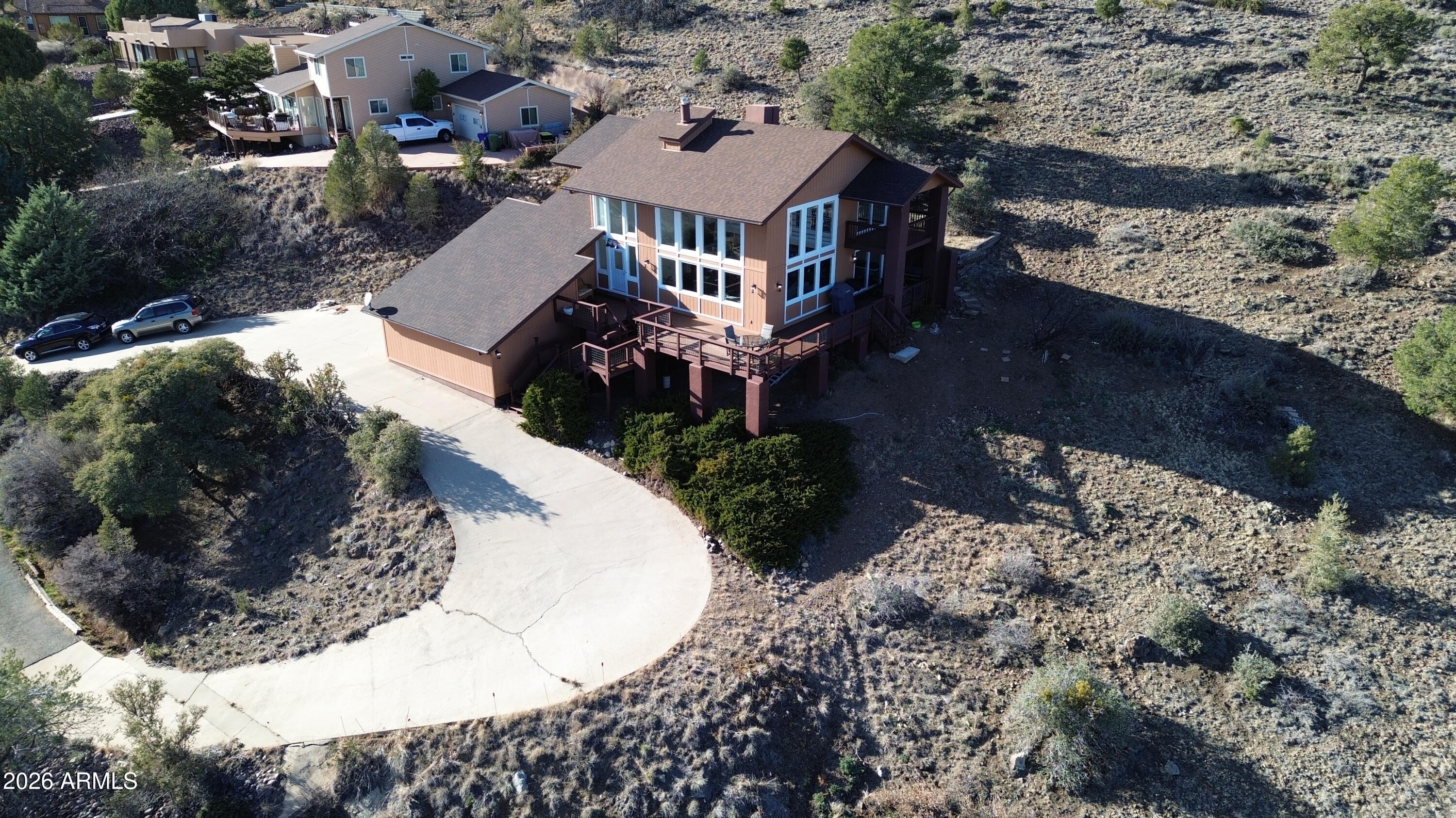 4880 Comanche Trail Prescott, AZ 86301 - Photo 8 of 44 an aerial view of a house with a yard and large trees