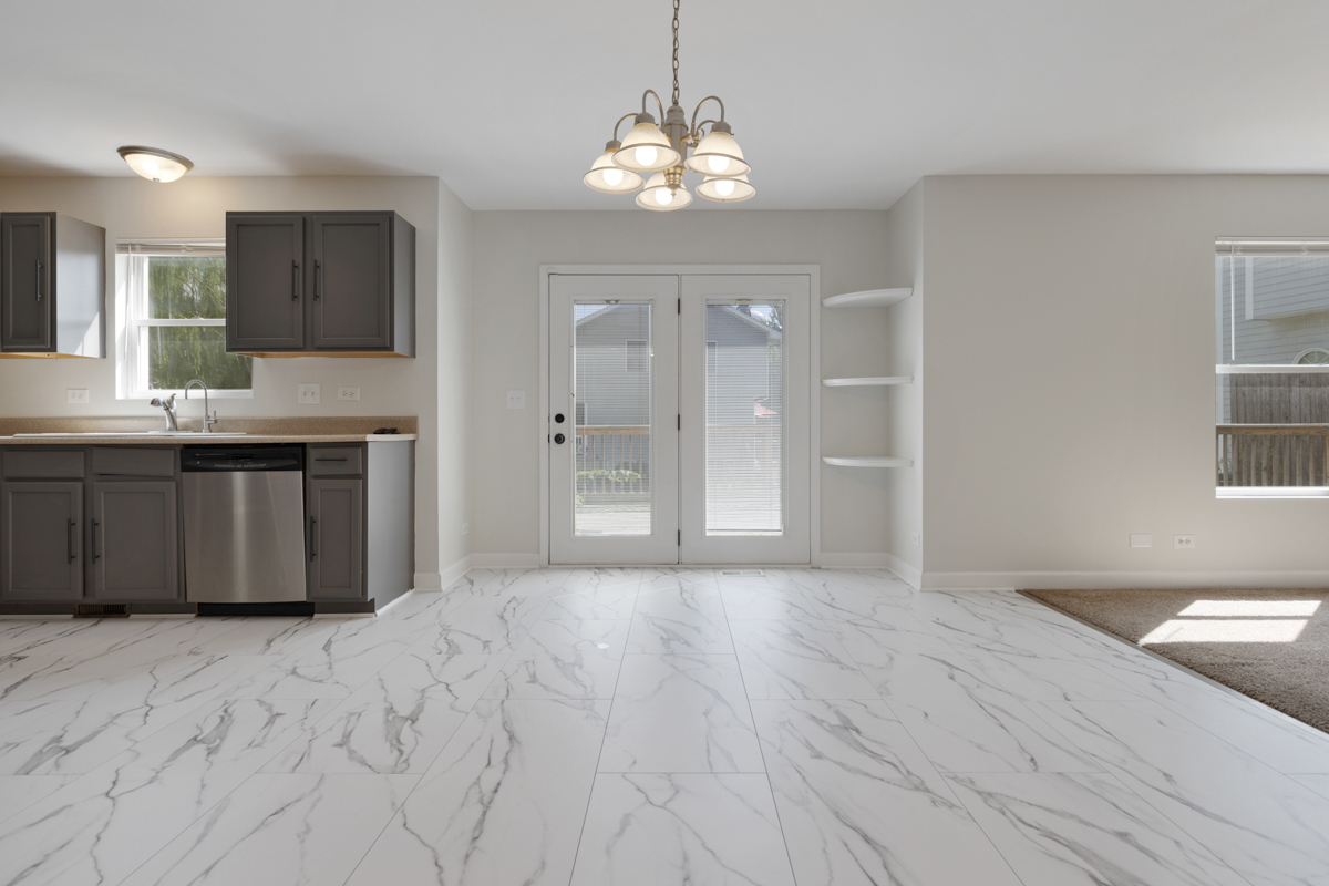 399 Fulton Street South Elgin, IL 60177 - Photo 2 of 36 a spacious bathroom with a granite countertop sink a mirror and a shower