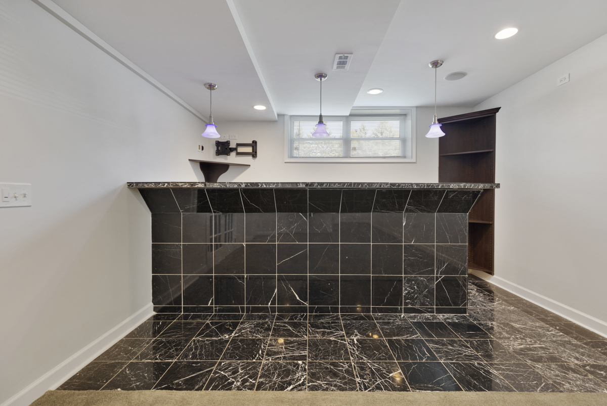 399 Fulton Street South Elgin, IL 60177 - Photo 29 of 36 a bathroom with a black white checkered floor