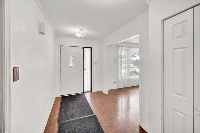 a view of entryway with wooden floor