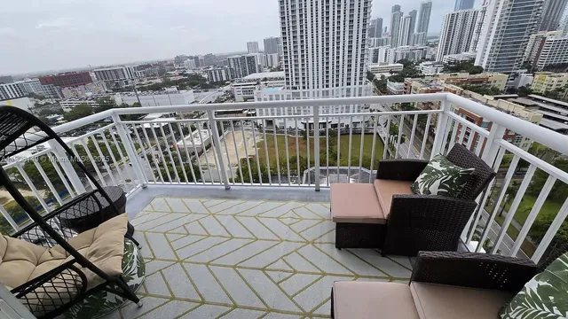 a view of a balcony with chairs