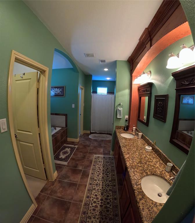 6401 County Road 3208 Lone Oak, TX 75453 - Photo 13 of 26 a bathroom with sink mirror and toilet