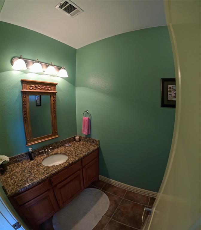 6401 County Road 3208 Lone Oak, TX 75453 - Photo 17 of 26 a bathroom with a sink and a mirror