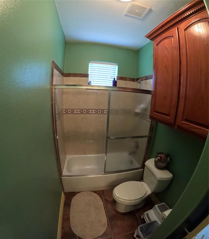 6401 County Road 3208 Lone Oak, TX 75453 - Photo 18 of 26 a bathroom with a toilet and a shower