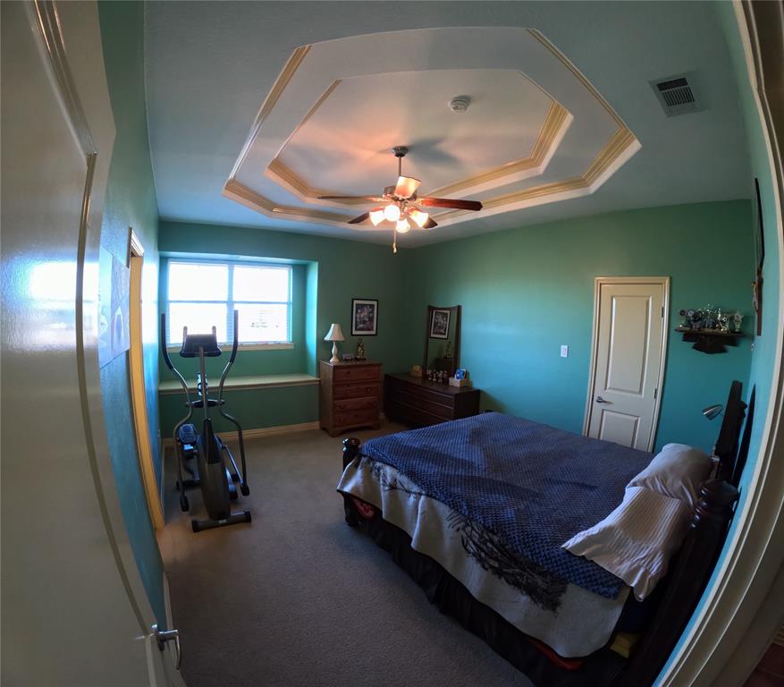 6401 County Road 3208 Lone Oak, TX 75453 - Photo 24 of 26 a bed room with two beds and a chandelier