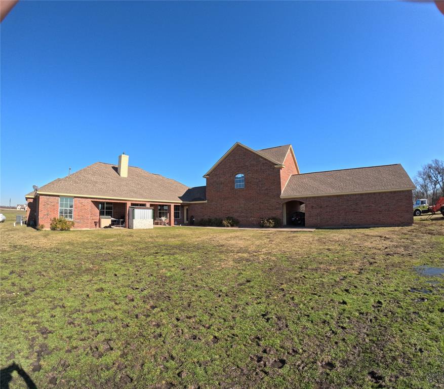 6401 County Road 3208 Lone Oak, TX 75453 - Photo 4 of 26 a yellow house with a big yard