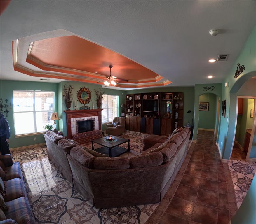 6401 County Road 3208 Lone Oak, TX 75453 - Photo 7 of 26 a living room with fireplace furniture and a fireplace