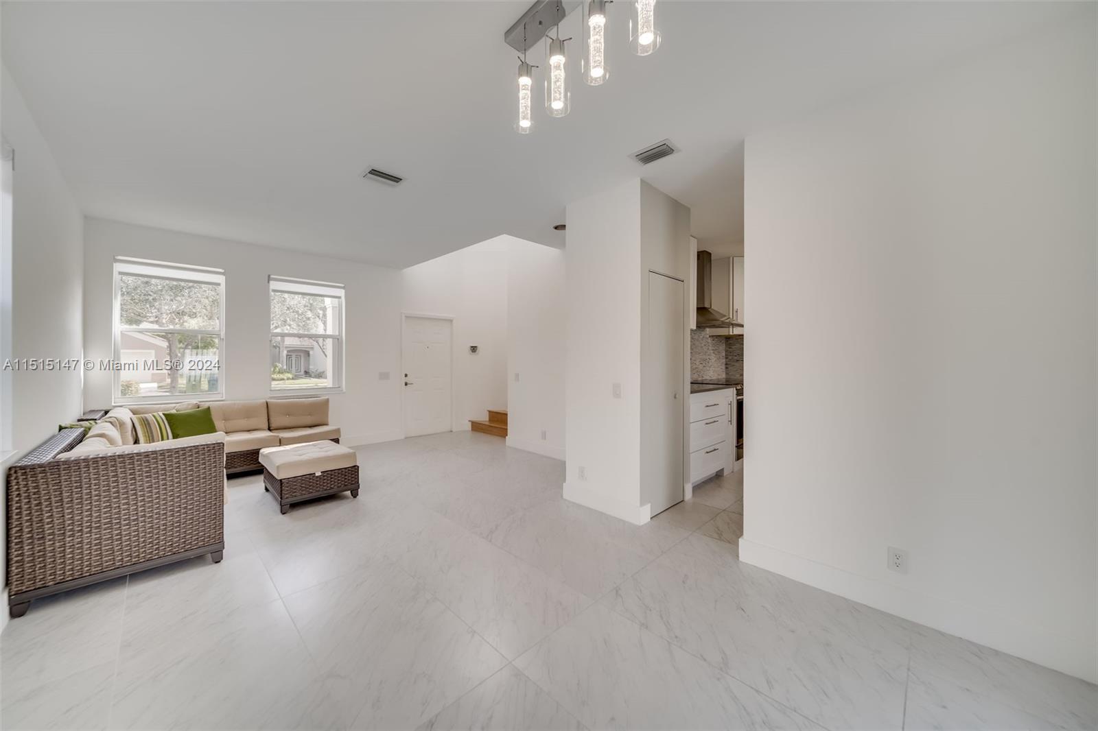 958 Briar Ridge Road Weston, FL 33327 - Photo 13 of 55 a living room with furniture and a large window