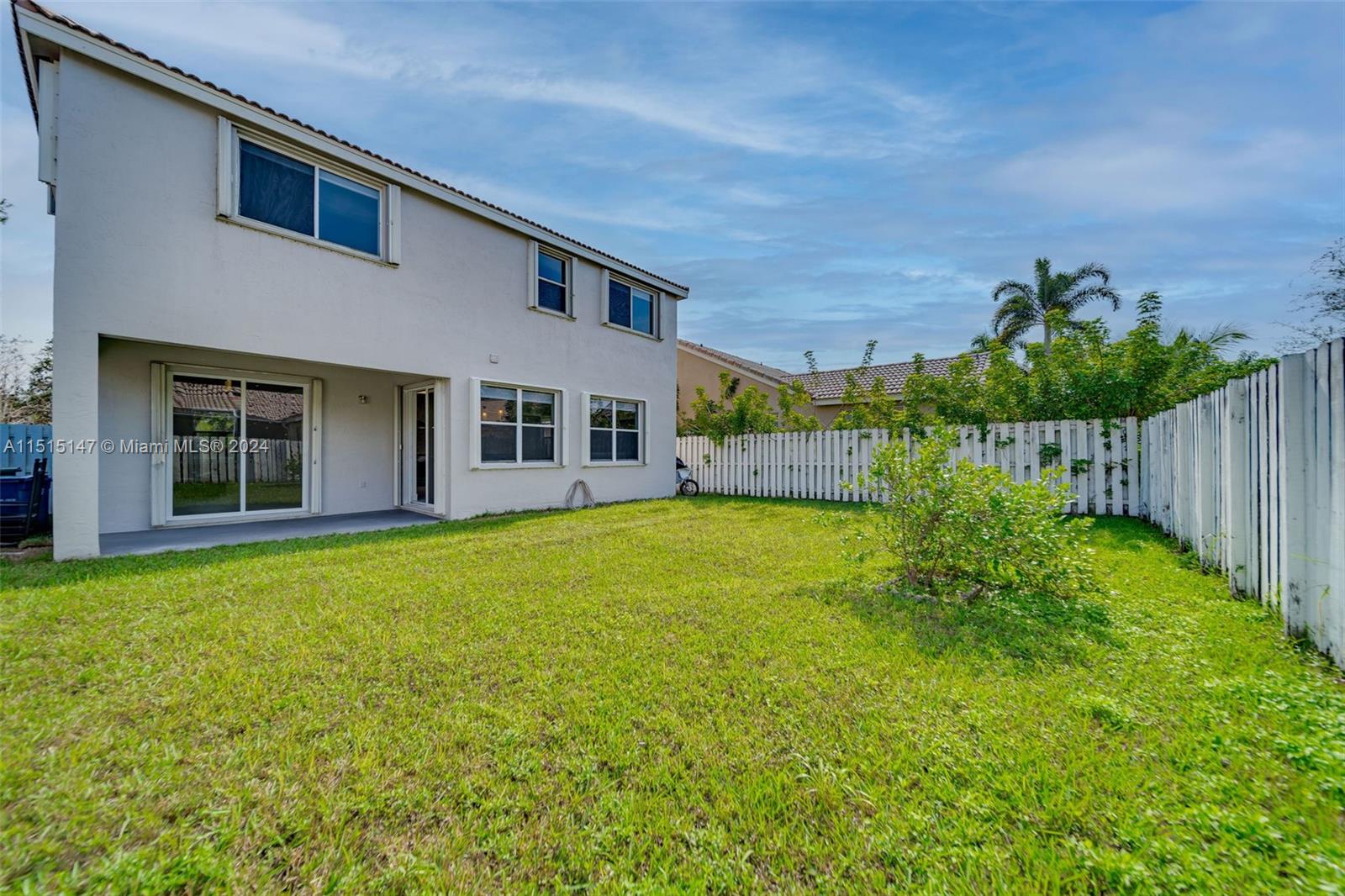 958 Briar Ridge Road Weston, FL 33327 - Photo 18 of 55 a view of a house with a backyard