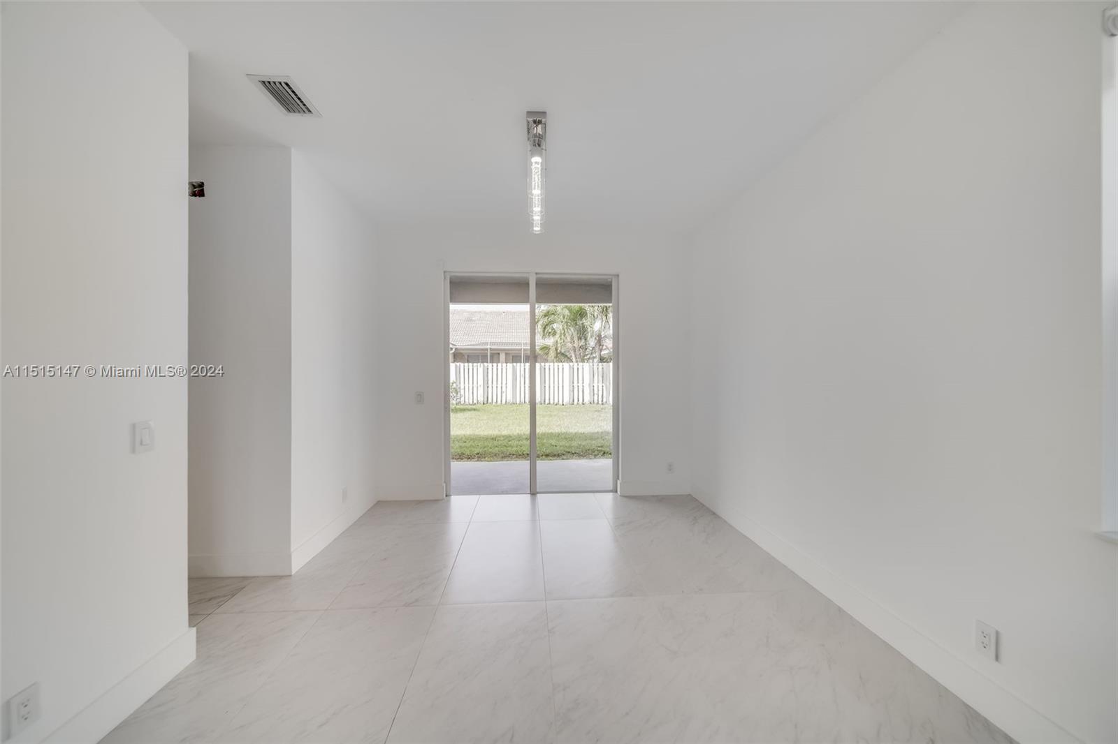 958 Briar Ridge Road Weston, FL 33327 - Photo 21 of 55 a view of an empty room with a window