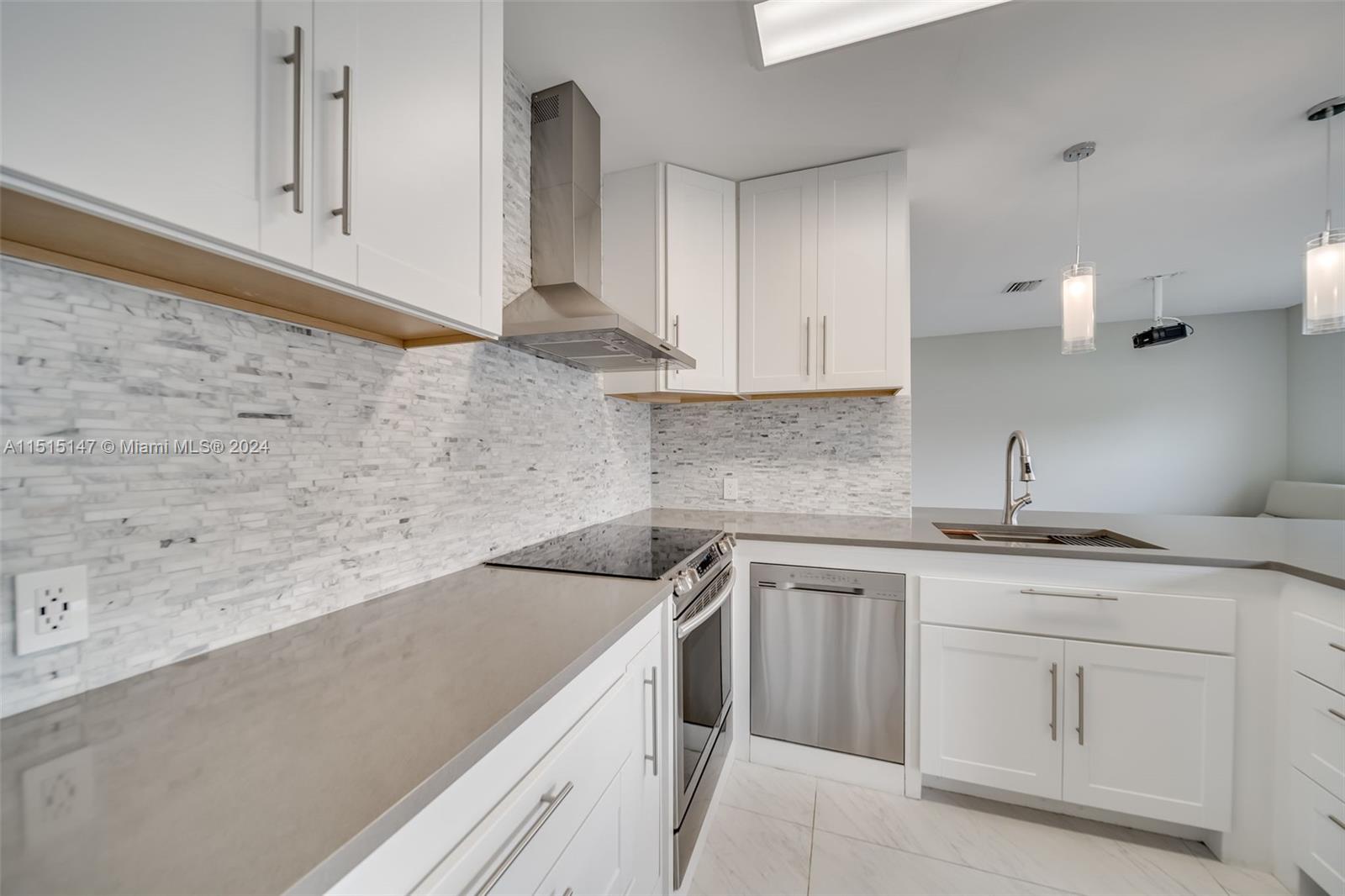 958 Briar Ridge Road Weston, FL 33327 - Photo 25 of 55 a kitchen with white cabinets sink and dishwasher