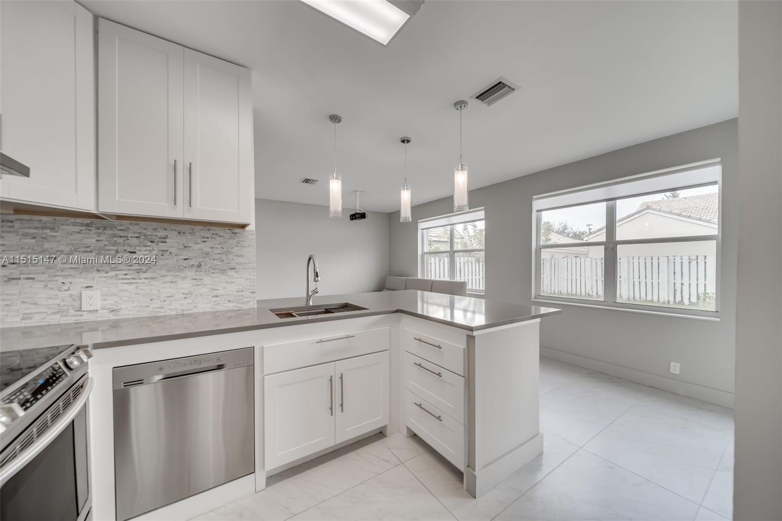 958 Briar Ridge Road Weston, FL 33327 - Photo 26 of 55 a kitchen with a sink stove and cabinets