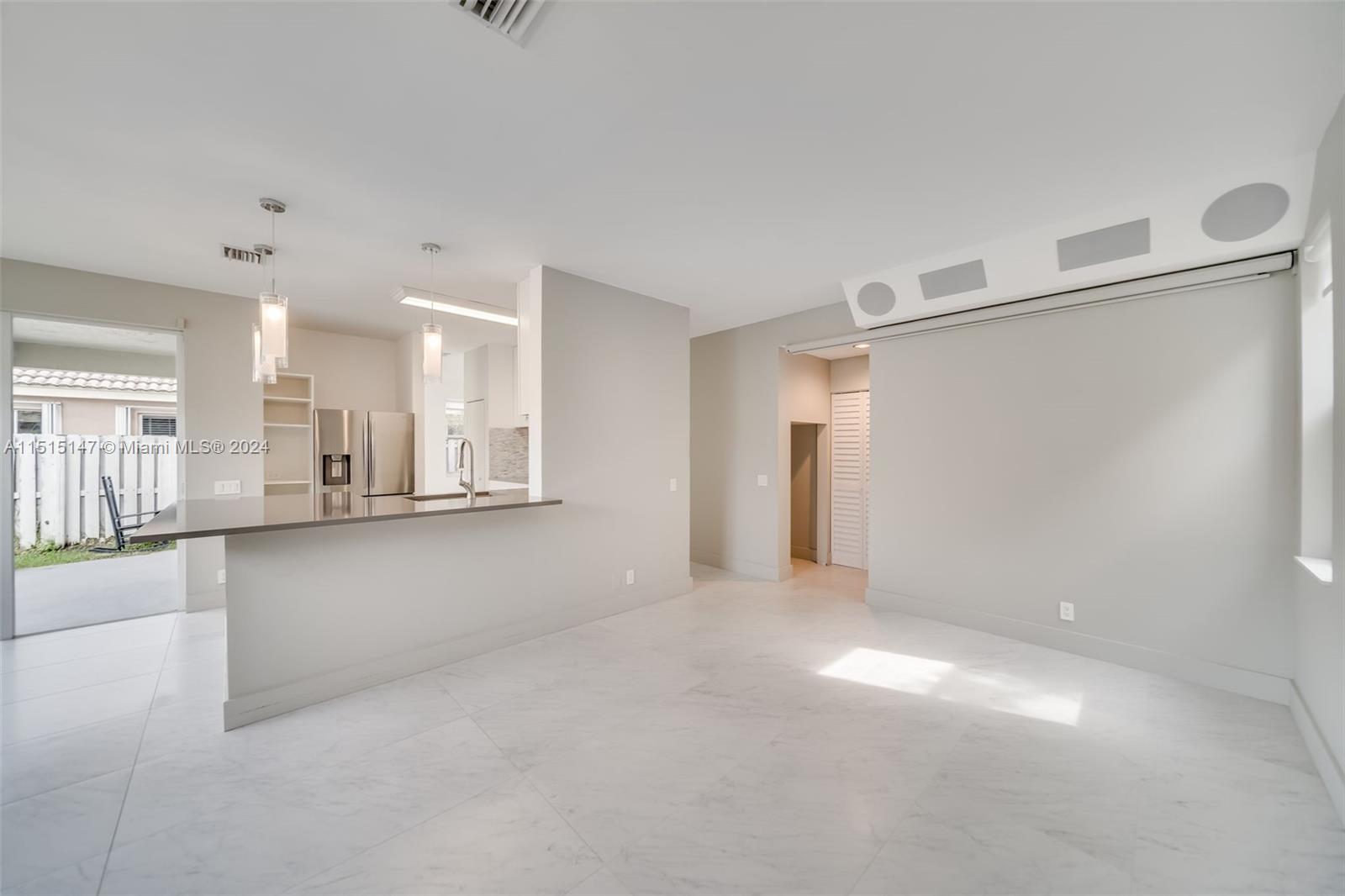 958 Briar Ridge Road Weston, FL 33327 - Photo 31 of 55 a view of a kitchen with a sink and a cabinet