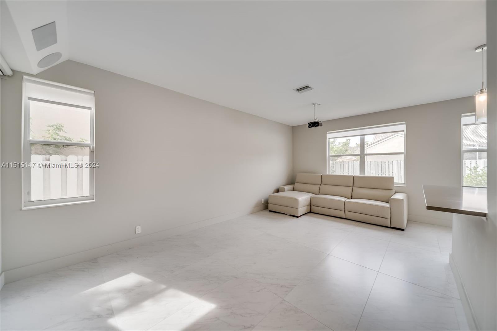 958 Briar Ridge Road Weston, FL 33327 - Photo 32 of 55 a living room with furniture and a window