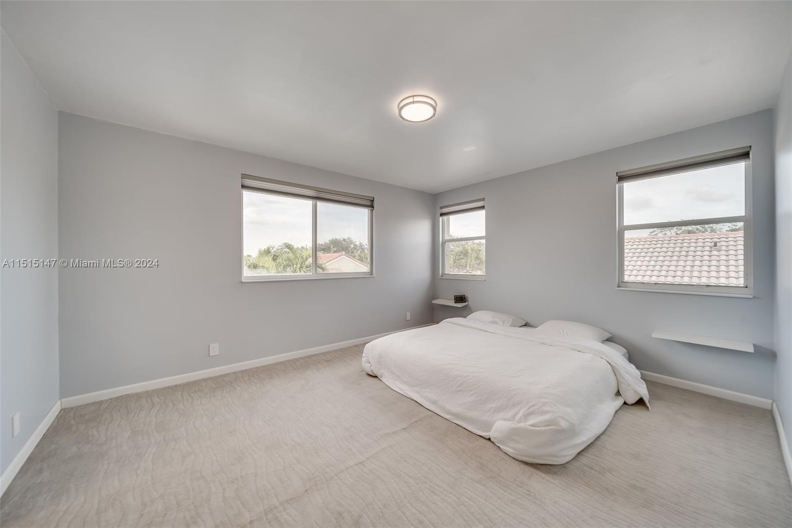 958 Briar Ridge Road Weston, FL 33327 - Photo 34 of 55 a bedroom with a bed and a window