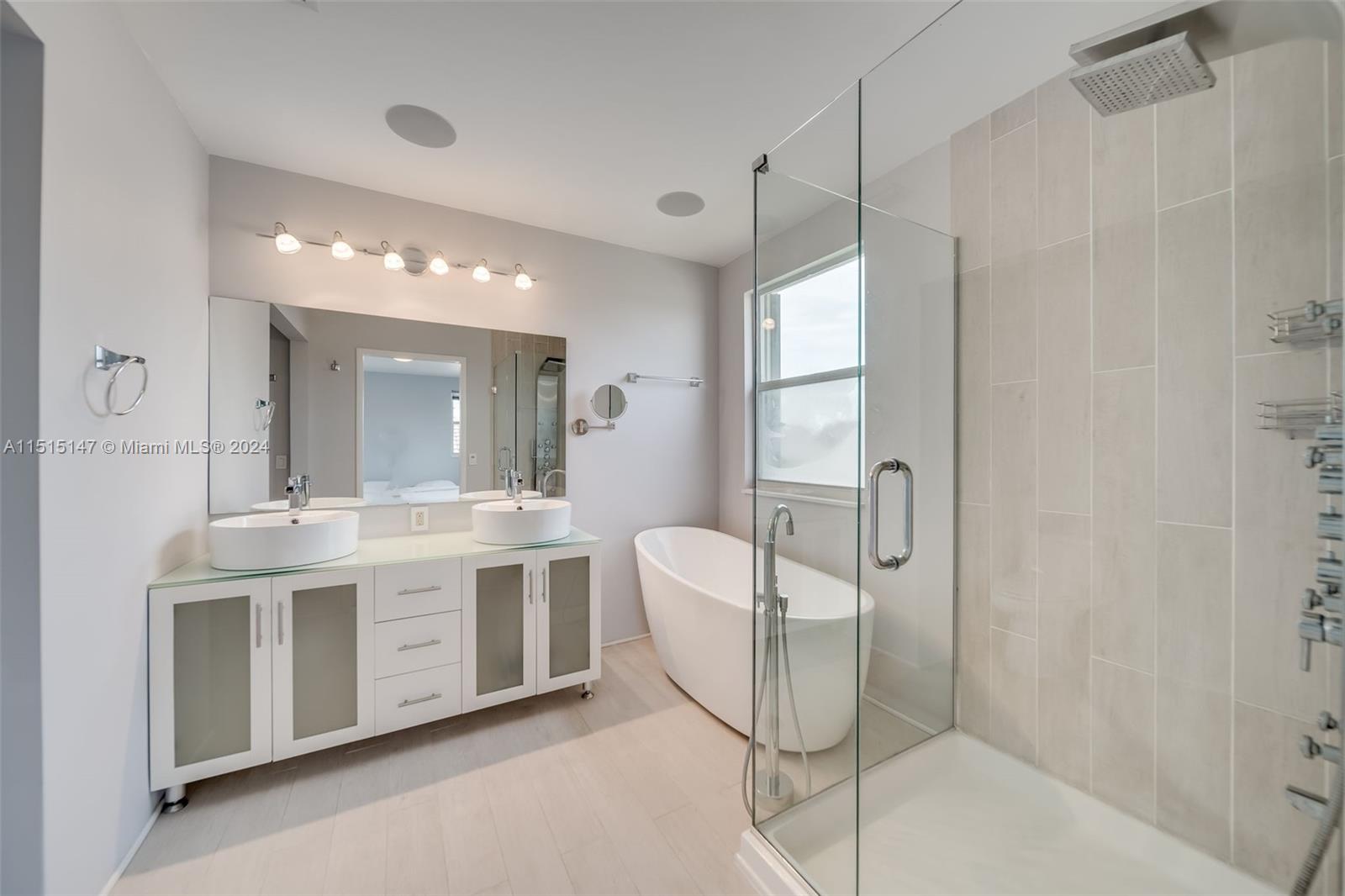 958 Briar Ridge Road Weston, FL 33327 - Photo 37 of 55 a bathroom with a double vanity sink mirror and shower